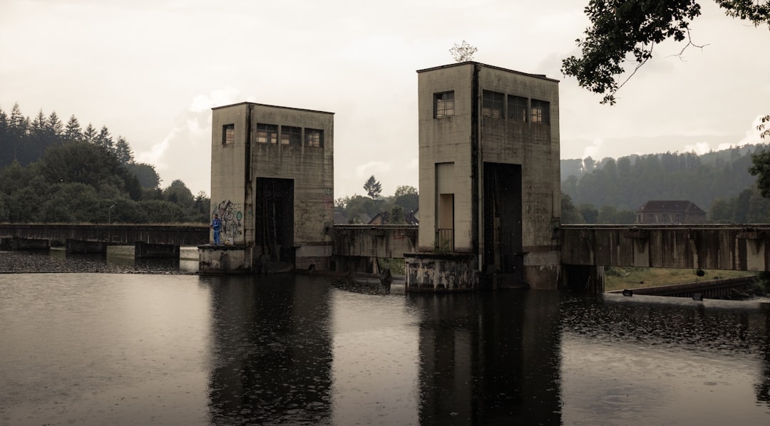 brown concrete building near body of water during daytime