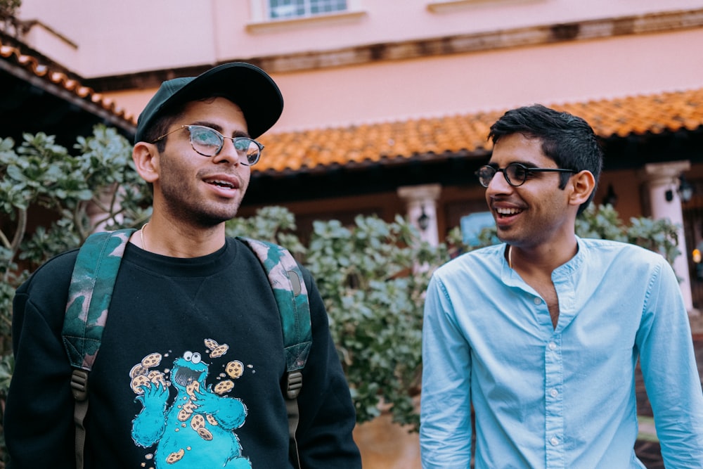 man in blue crew neck shirt beside man in blue crew neck shirt