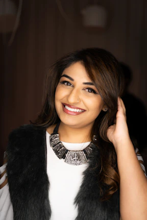woman in black fur vest