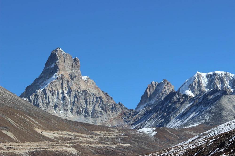 snow covered mountain under blue sky during daytime