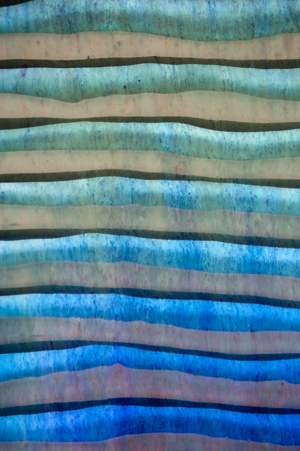 brown blue and white stripe textile