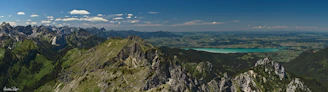 A panoramic view of the Wyoming wilderness with distant mountains and sparkling water.