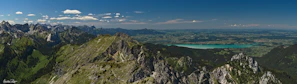 A panoramic view of the Patagonian landscape with mountains and lakes, highlighting the natural beauty of Chubut.