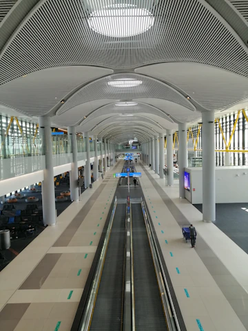 Modern airport terminal with sleek architecture and soft natural lighting.