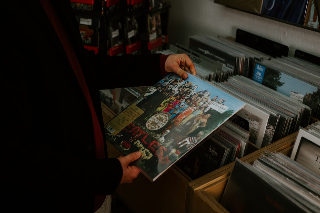 person holding a magazine in a room