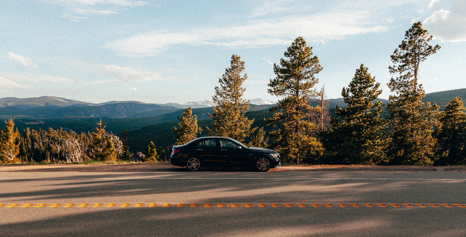 Canon EOS-1D Mark II + Canon EF 24-105mm F4L IS USM sample photo. Black sedan on road photography