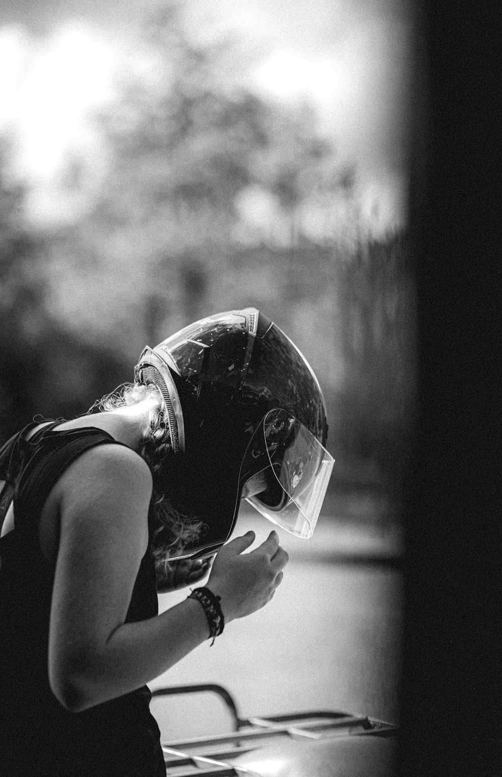 woman in white tank top wearing helmet