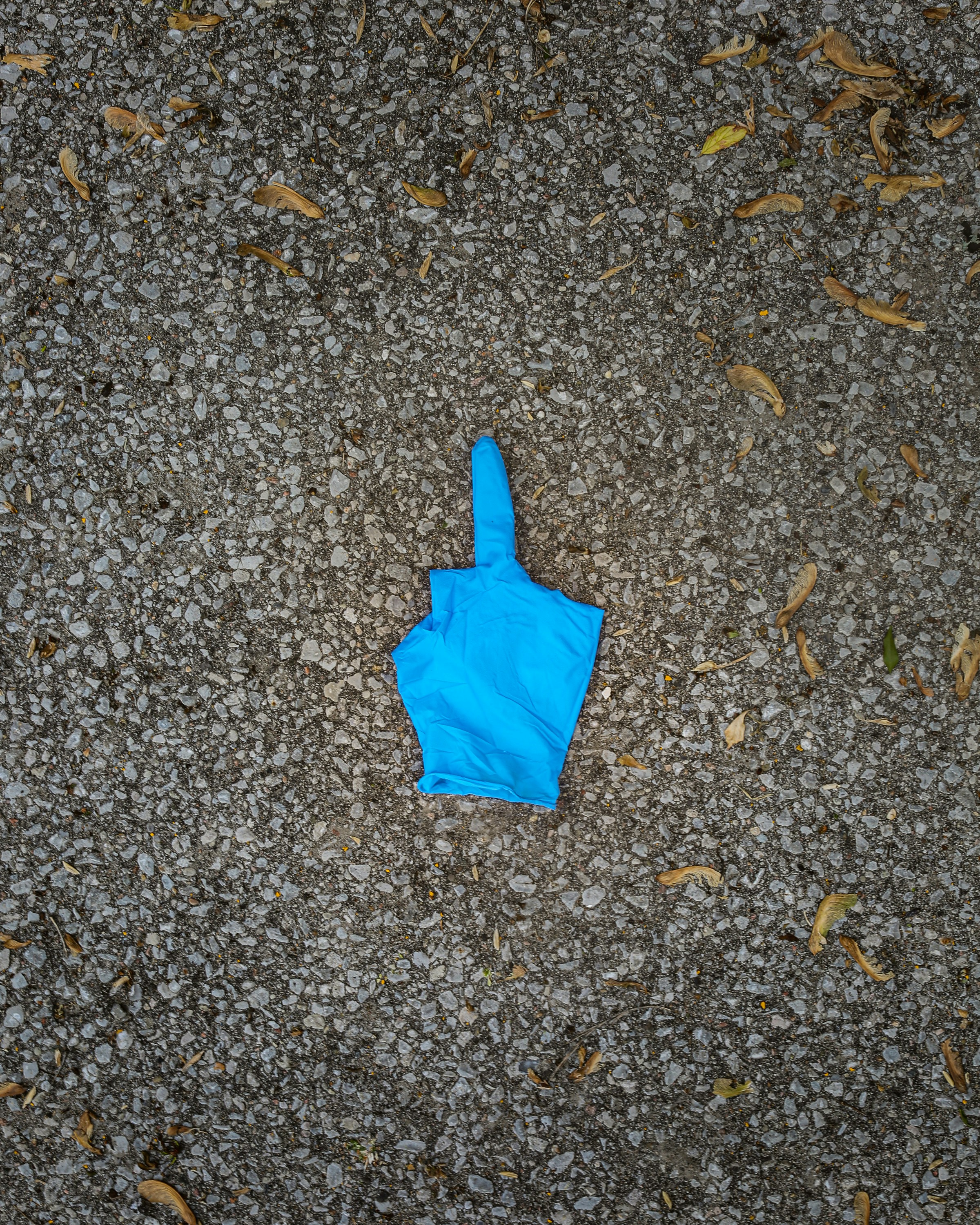 blue balloon on gray ground