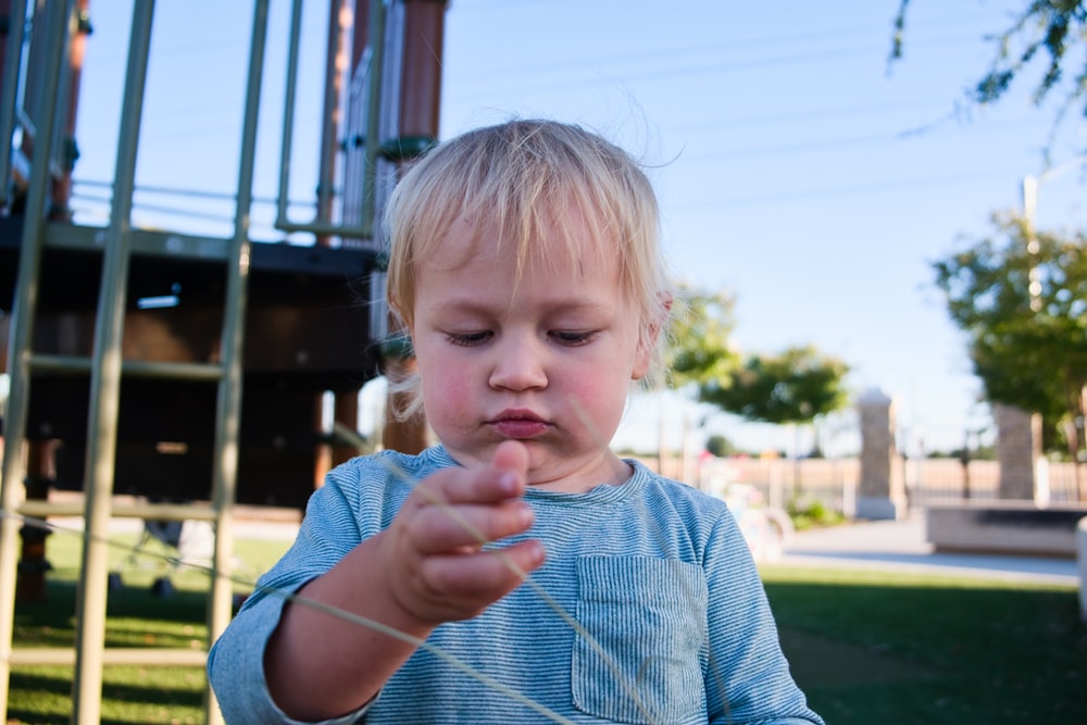 boy in blue and white striped shirt