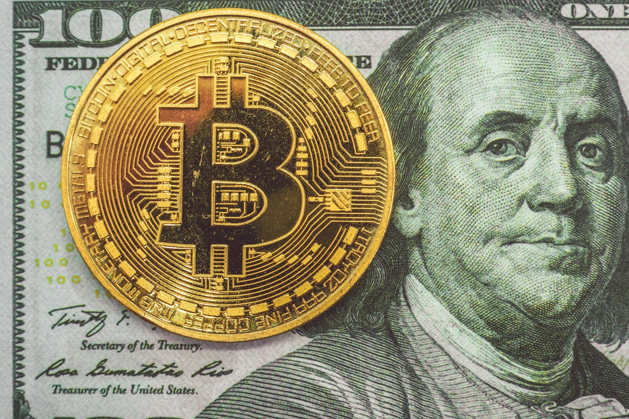 Bitcoin on hundred dollars bills