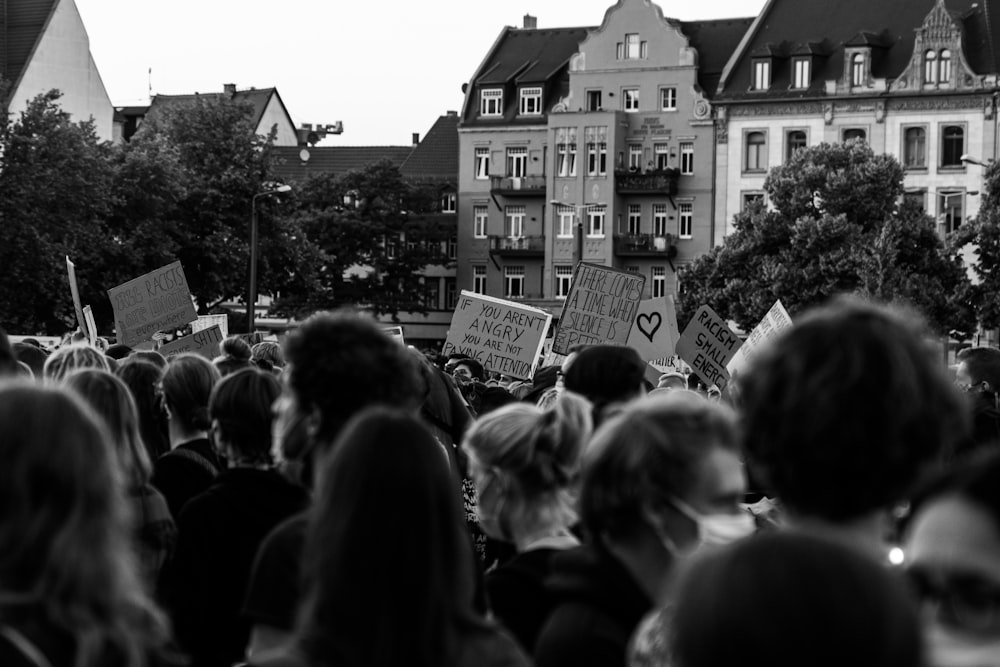 grayscale photo of people walking on street