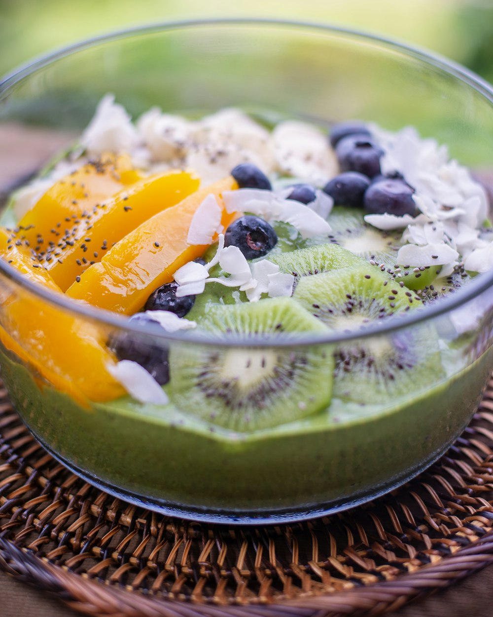 sliced fruits in clear glass bowl