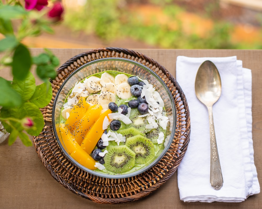 sliced fruit on green and brown ceramic bowl