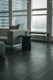 gray sofa chair near window