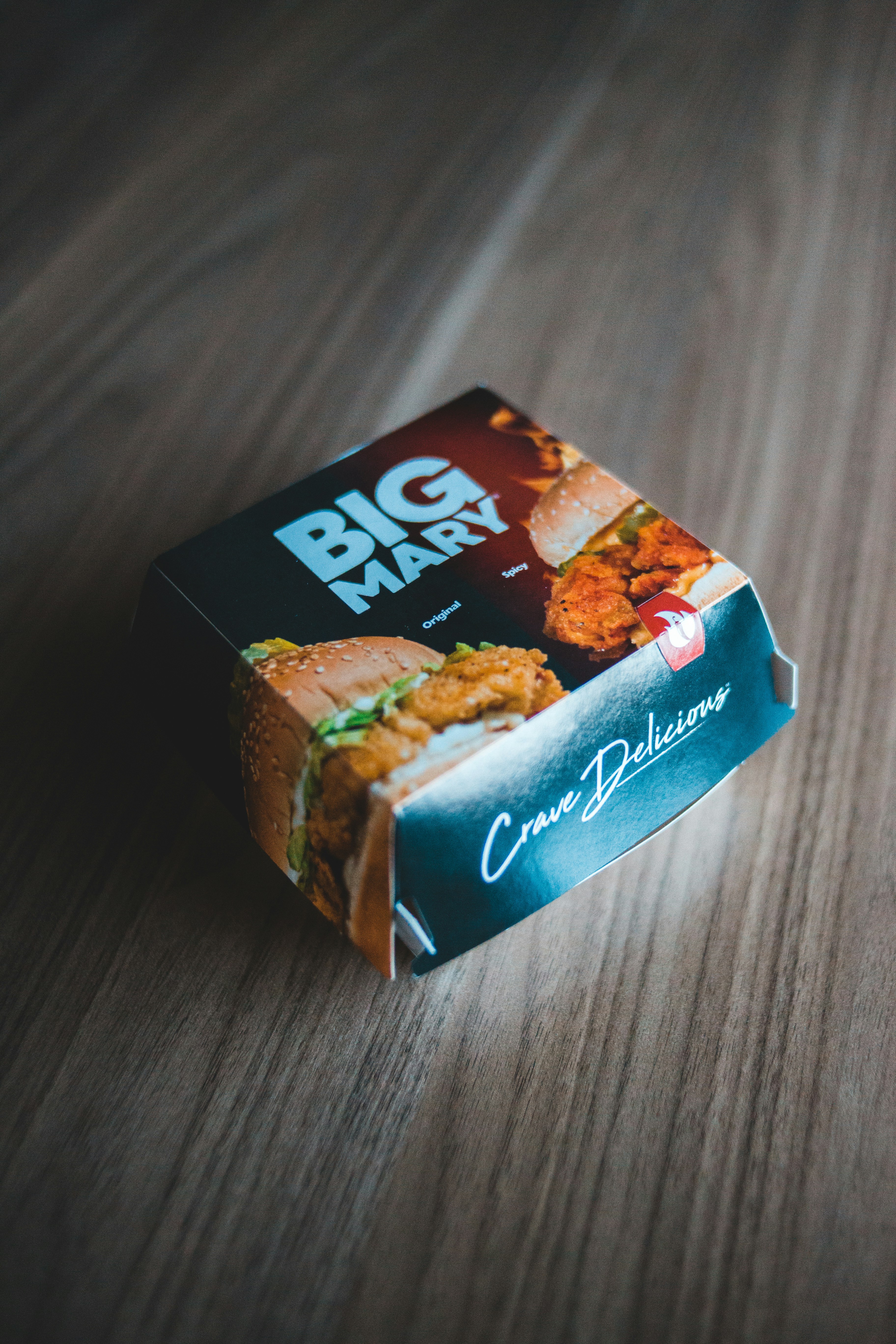 a sandwich box sitting on top of a wooden table