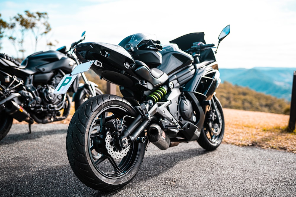 black and gray sports bike on gray sand during daytime