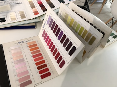 An array of hair color samples displayed on a table, showcasing various shades and textures.
