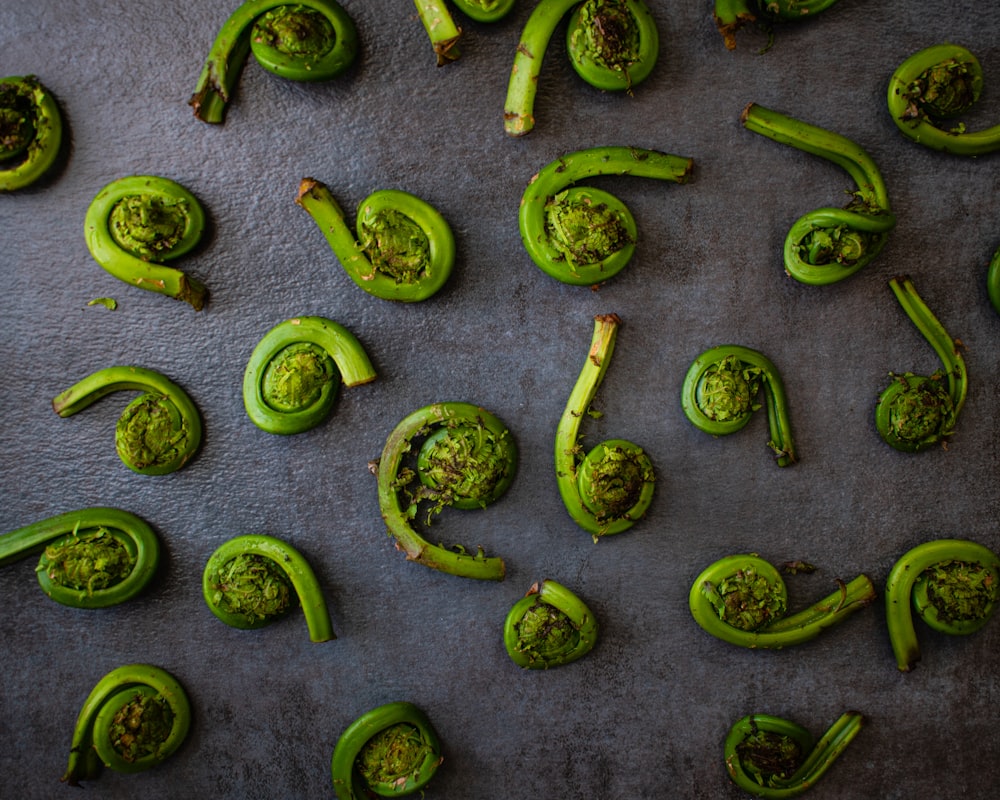 green chili peppers on gray surface