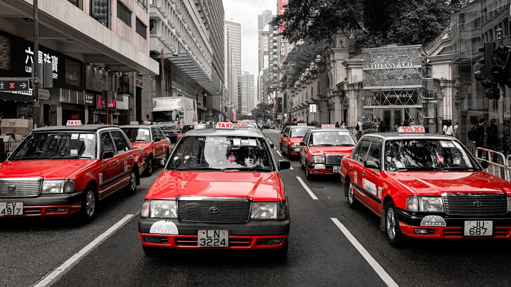 red car on the street during daytime