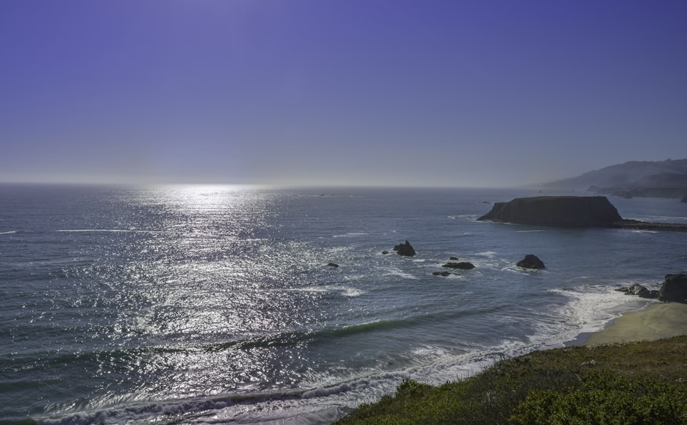 blue sea under blue sky during daytime