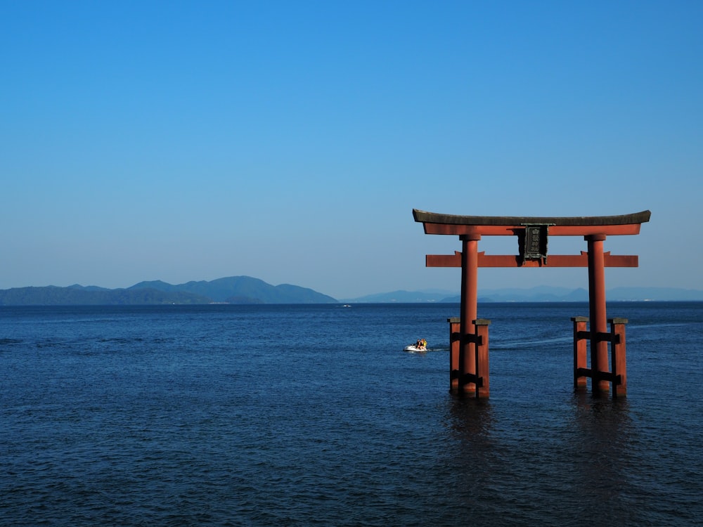 brown wooden dock on body of water during daytime