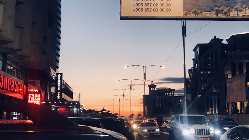 cars on road during sunset