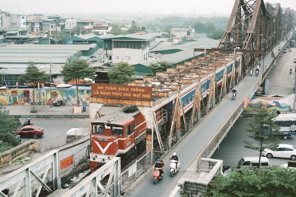 red and white train on rail road during daytime