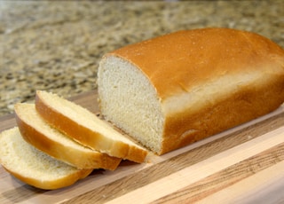 bread on brown wooden chopping board