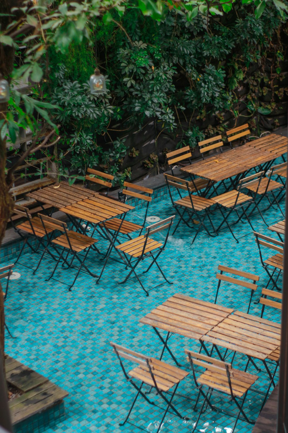 brown wooden folding chairs on brown brick floor