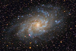 Illustration of a glowing galaxy spiral.