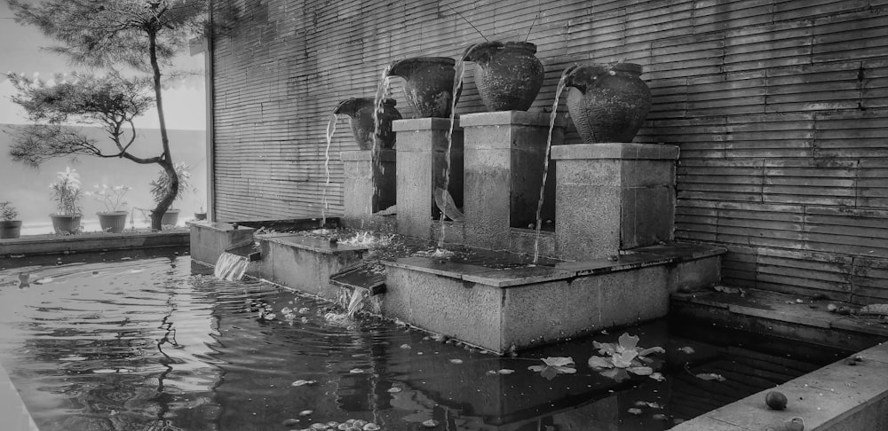 water fountain in grayscale photography