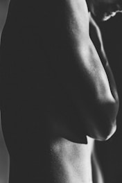 grayscale photo of topless woman
