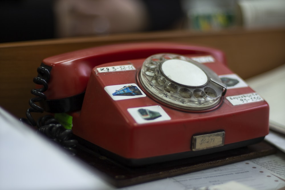 red and silver rotary phone