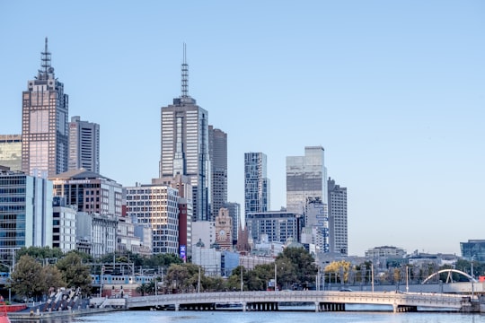 city skyline under blue sky during daytime in Melbourne City Centre Australia
