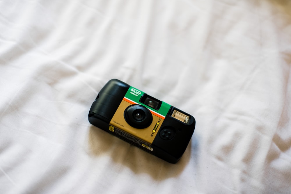 black and green point and shoot camera