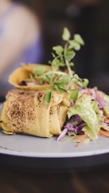 bread with vegetable on white ceramic plate