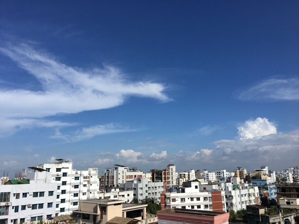 white and brown concrete buildings under blue sky during daytime