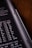 A close-up view of a calculator or electronic device with a black background. White alphanumeric symbols and numbers are visible, indicating various mathematical or scientific units.