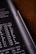 A close-up view of a calculator or electronic device with a black background. White alphanumeric symbols and numbers are visible, indicating various mathematical or scientific units.