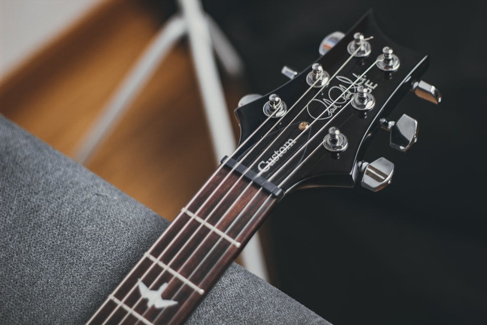 black and silver guitar pick