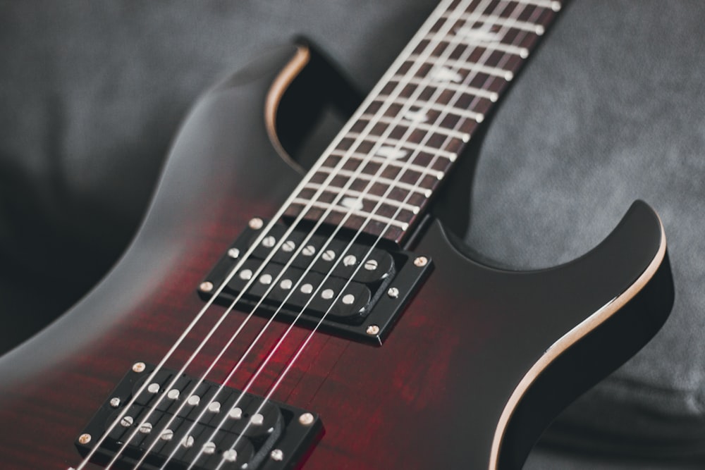 red and black electric guitar