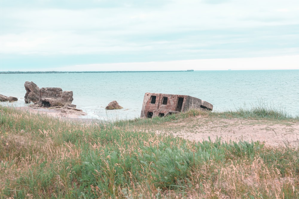 brown and red concrete building near body of water during daytime