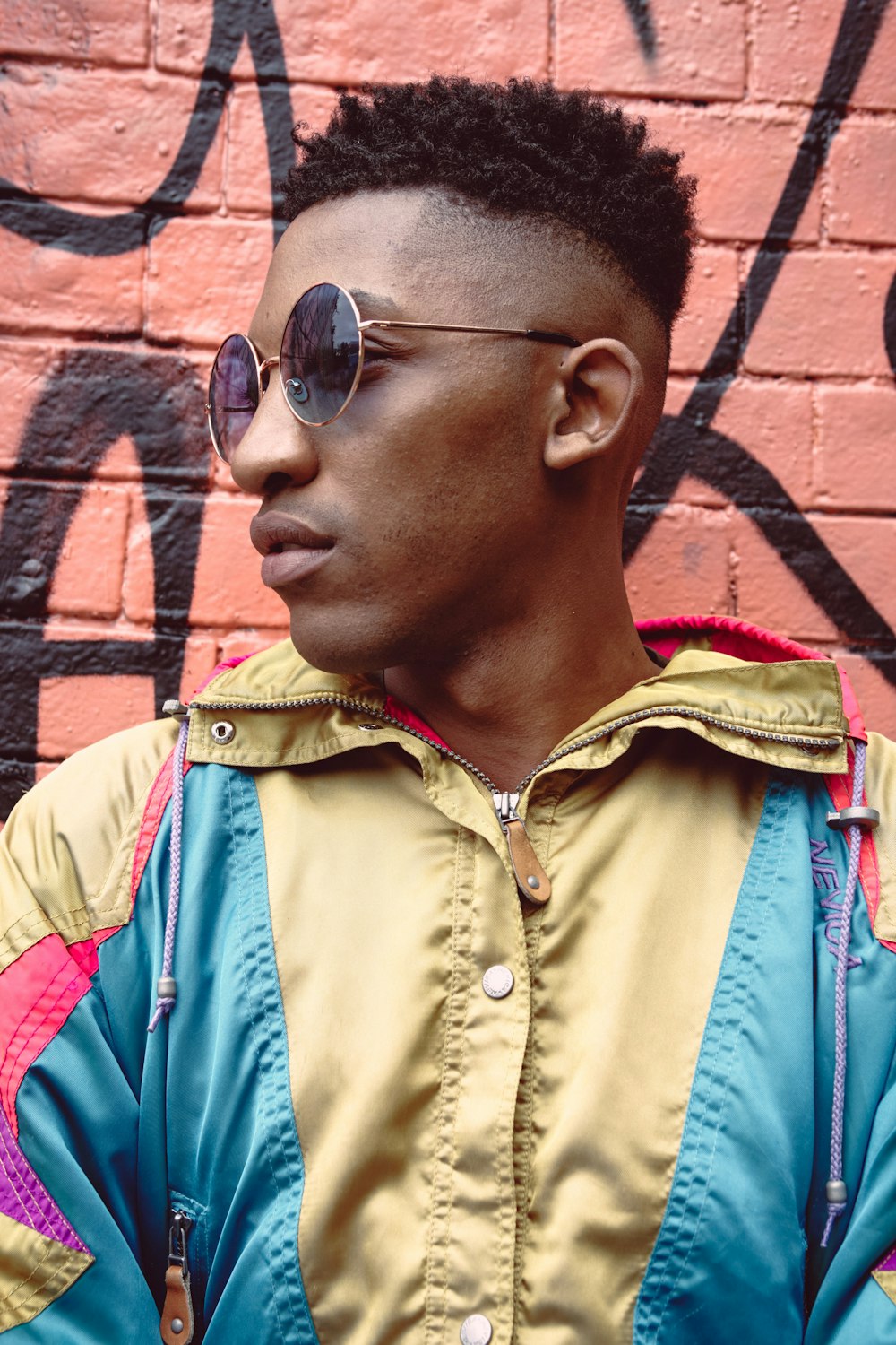 man in brown button up shirt wearing sunglasses