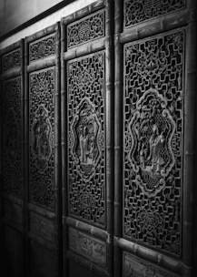 Hand-carved wooden frame with detailed traditional motifs.