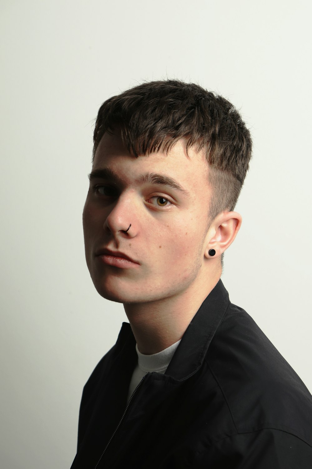 man in black collared shirt