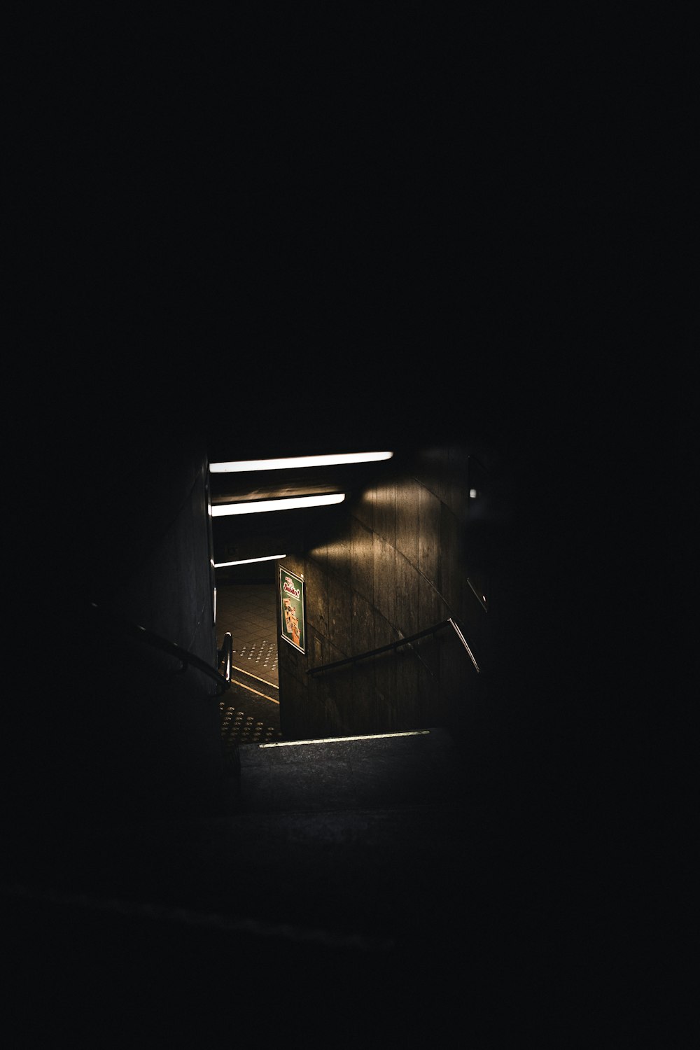 brown wooden stairs in dark room