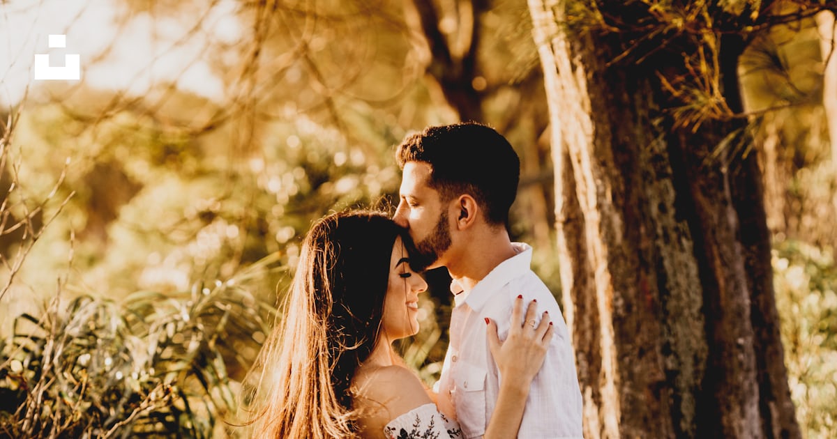 Man and woman kissing near brown tree during daytime photo – Free ...