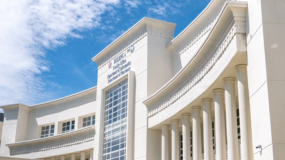 white concrete building under blue sky during daytime