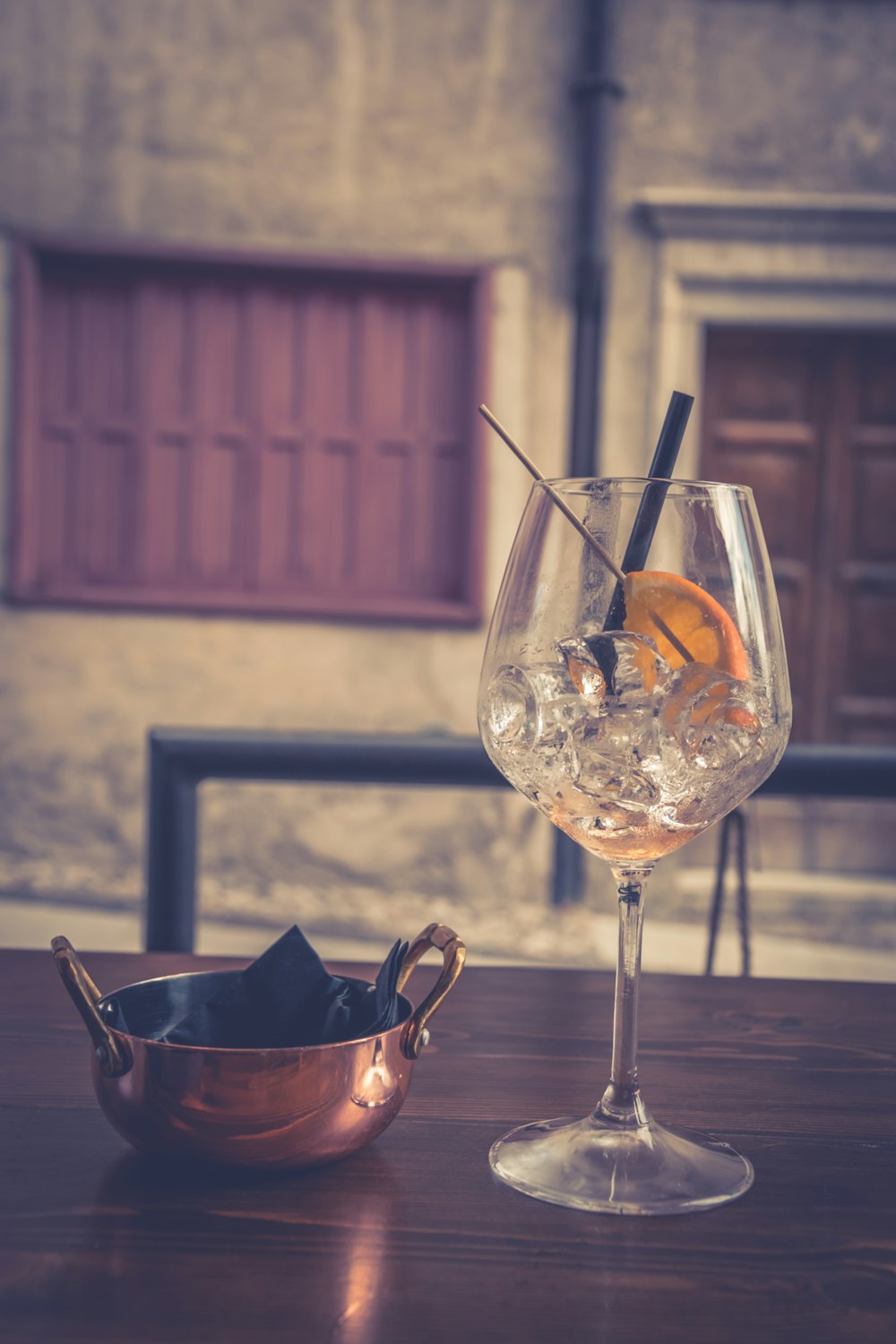 clear wine glass with orange liquid