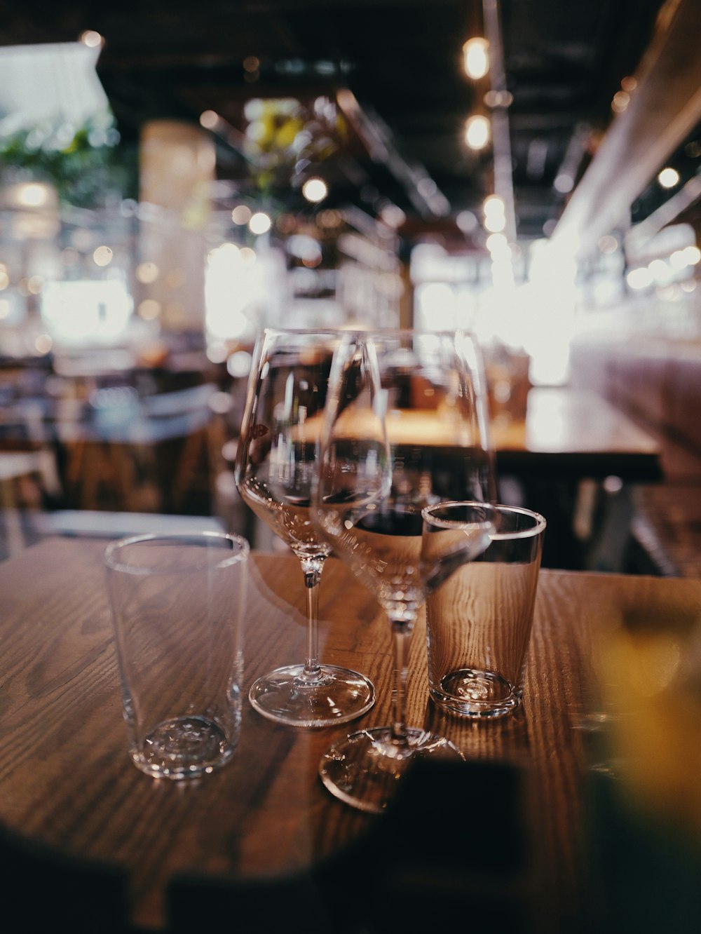 clear wine glass on brown wooden table